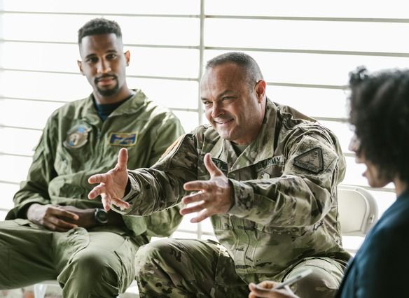 3 Veterans in uniform talking together