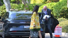 News Corp chief executive Robert Thomson arrives with his wife Wang Ping at Rupert Murdoch’s family vineyard on Sunday, attending the media baron’s fifth wedding.