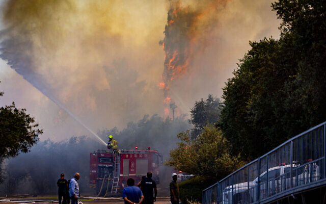 Firefighters work to extinguish a fire that broke out near the Israel Museum in Jerusalem, June 2, 2024. (Chaim Goldberg/Flash90)