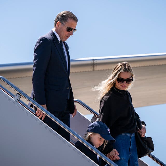 Hunter Biden, Melissa Cohen and Beau walking down the steps from an airplane.